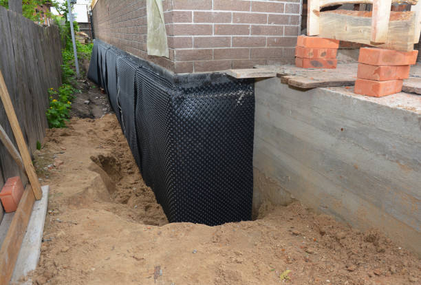 SJ Waterproofing Pros technician performing targeted Wet Basement Repair assessment in Hanover, OH